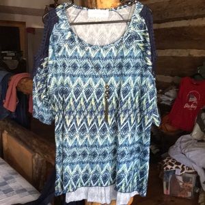 100% Polyester, soft, flowy blouse.